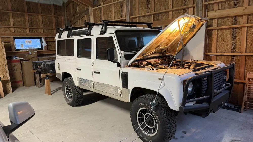 Three-quarter view of the Perentie 110 in the garage with hood open